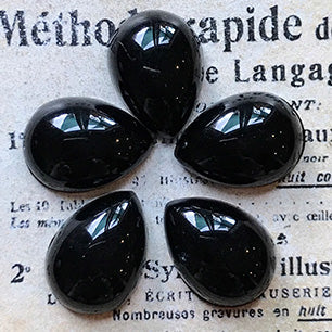 pear-shaped glass cabochon in black for jewelry making