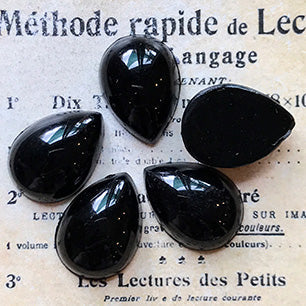 pear-shaped glass cabochon in black for jewelry making